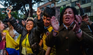 People celebrate in Bogota after the results of a referendum on whether to ratify a peace accord between the state and the communist FARC rebels.