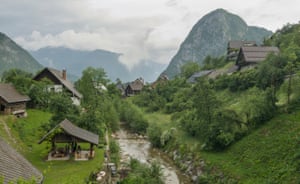 ‘All clouds spilling over nearby mountains and long sloping roofs’: a village in the Bohinj region.
