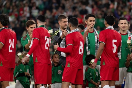 Palestinian players line up before kick-off