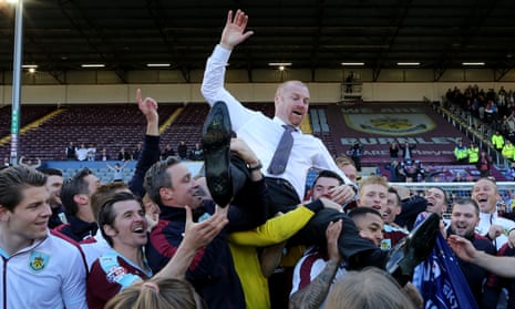Sean Dyche is thrown into the air by his jubilant Burnley players