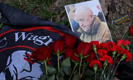 A portrait of Wagner mercenary chief Yevgeny Prigozhin at a makeshift memorial near former PMC Wagner Centre in Saint Petersburg, Russia 24 August.