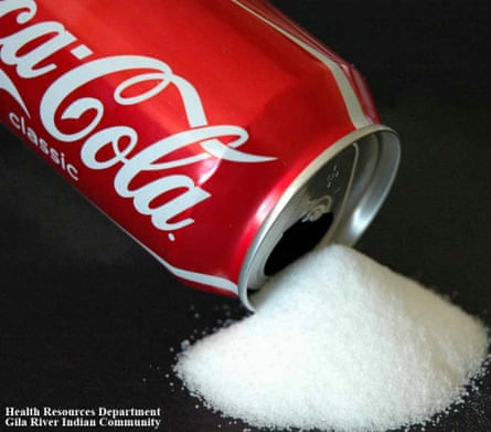 An advert picturing sugar pouring from a can of Coca-Cola.
