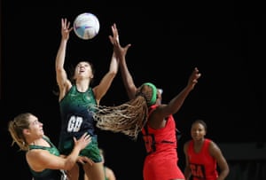 Fionnula Toner of Northern Ireland jumps for the ball with Caroline Brighton of Malawi in their netball group match.