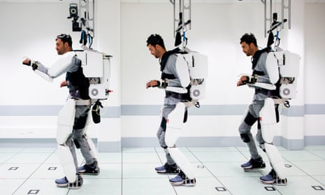 Thibault walks using the exoskeleton.