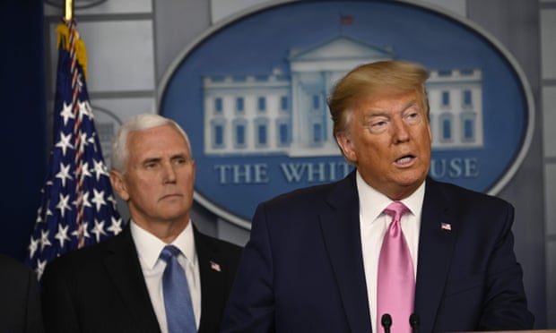 US president Donald Trump flanked by vice-president Mike Pence at the White House briefing. 