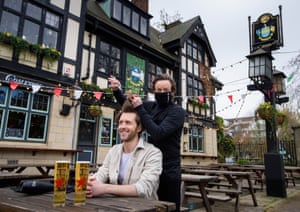 Bermondsey. Joe Foyster receives a free haircut whilst having a pint at a pop-up hairdressing station