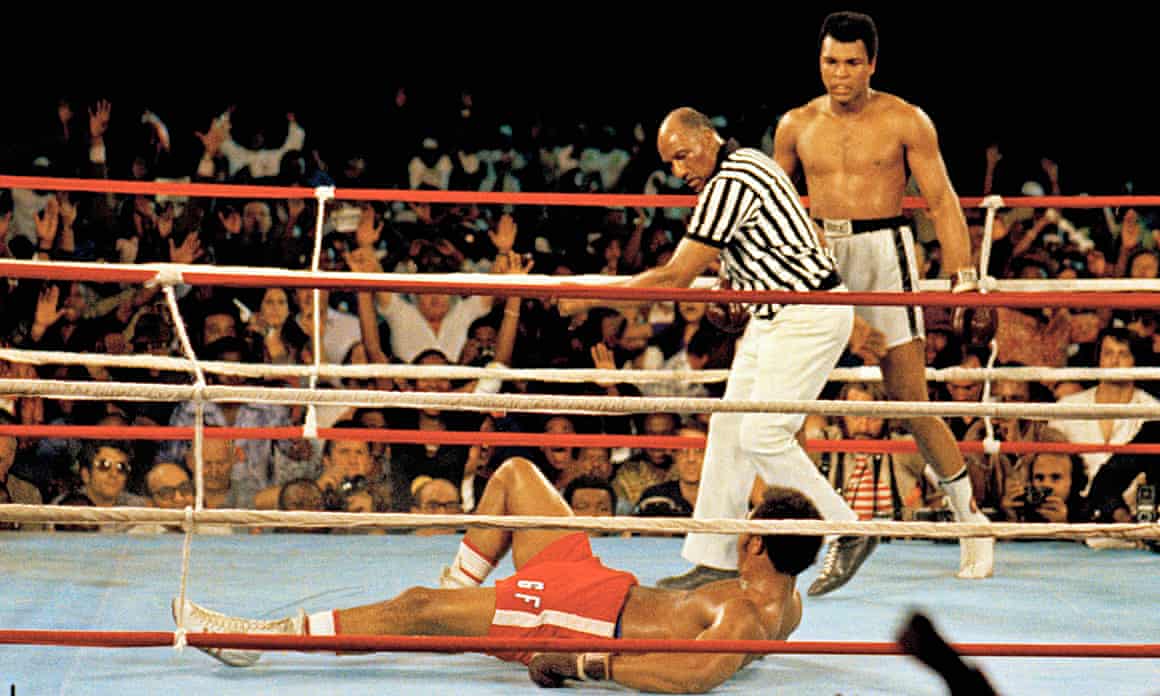 Muhammad Ali, right, stands back as referee Zack Clayton calls the count over opponent George Foreman.