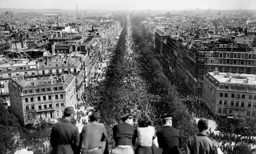 On May 8, 1945, Parisians gather on the Champs-Élysées to celebrate the German surrender in the second world war.