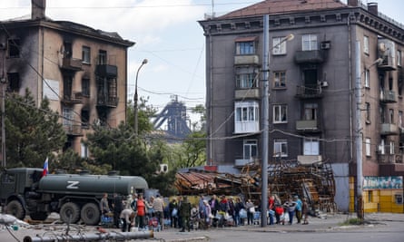 Local civilians gather to receive pure water in territory under the government of the so-called Donetsk People’s Republic, eastern Ukraine