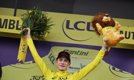 Danish rider Jonas Vingegaard of team Jumbo-Visma celebrates on the podium after winning the 16th stage.