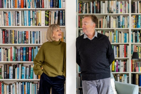 British novelist Kate Mosse and her husband Greg Mosse in front of bookshelves