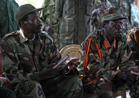Joseph Kony (left) and his deputy, Vincent Otti, sitting inside a tent in November 2006 in what is now South Sudan during a meeting the with UN humanitarian chief Jan Egeland.