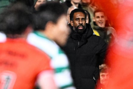 Wilfried Nancy pictured through a crowd of players during Celtic’s defeat at Dundee United