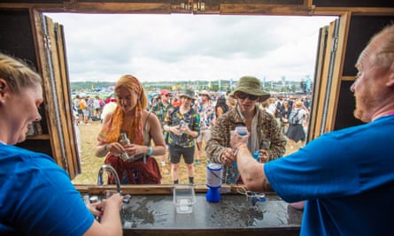 WaterAid volunteers provide free water to Glastonbury festival goers in 2022.