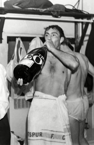 Greaves drinks from a large bottle of champagne in the Wembley dressing room as he celebrates Spurs’ 3-1 win over Burnley in the 1962 FA Cup final