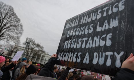 sign says 'when injustice becomes law, resistance becomes a duty'