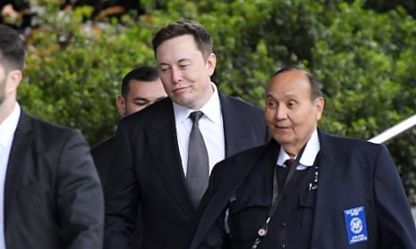  Elon Musk, second from right, arrives at US district court on Wednesday in Los Angeles.