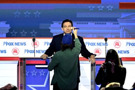 Ron DeSantis has his makeup touched up during the first Republican presidential primary debate.