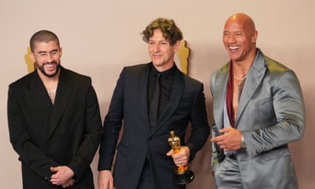 Glazer with Dwayne Johnson and Bad Bunny, who presented him with the award.