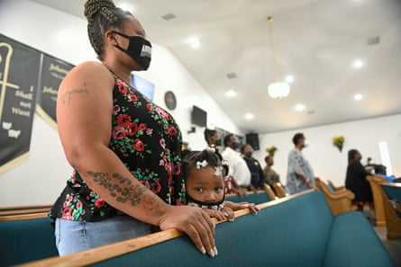 Three-year-old Lyrica Ray and her mother, Sharon Alexander, attend Sunday service at Bethesda Worship and Healing Center in Jonesboro, Arkansas on 8 August 2021.
