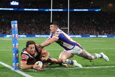 Mark Nawaqanitawase of the Roosters scores a diving try in the corner