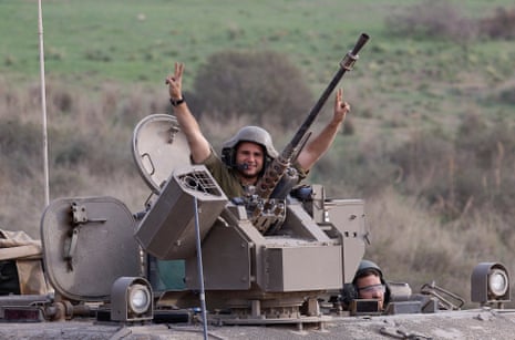 An Israeli soldier in military vehicle