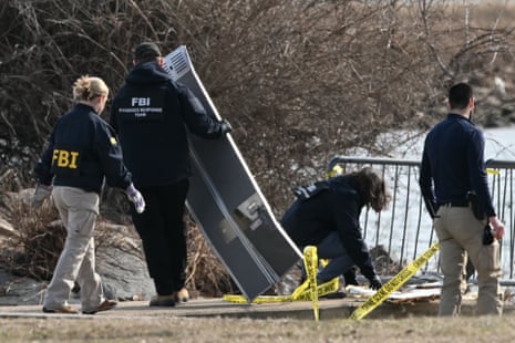 Investigators gather pieces of wreckage Investigators gather pieces of wreckage