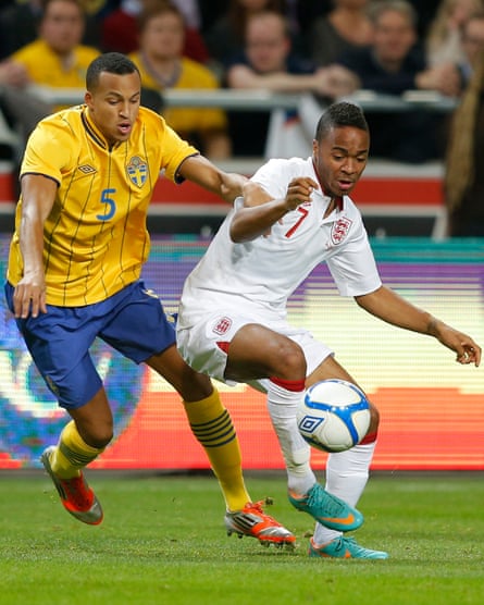 England's Raheem Sterling is challenged by Sweden's Martin Olsson during their international friendly soccer match at the Friends Arena in Stockholm in November 2012.