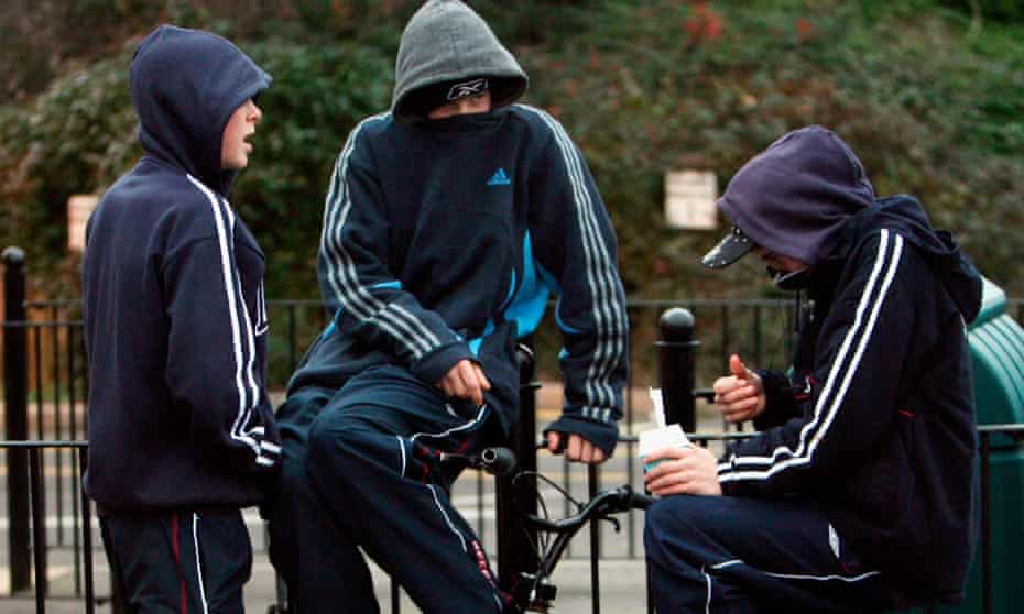 Young people in hooded tops