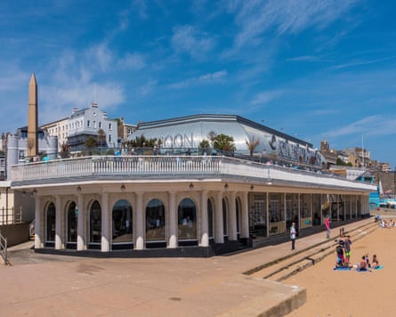 Colonnaded building with roof terrace on beach
