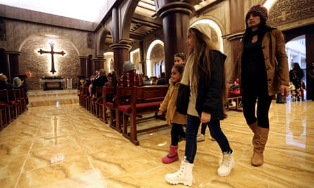Iraqi Christian children attend a mass at Church of Saint George in Teleskof, Iraq on Sunday.