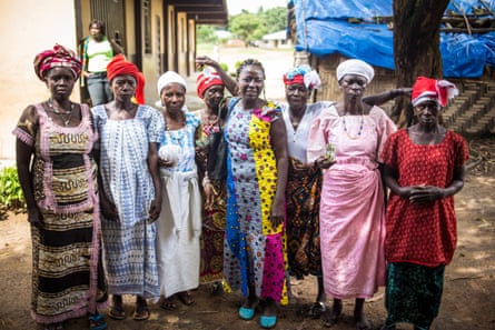A group of soweis, the most senior women in the Bondo secret societies. The chiefdom’s head sowei is Jeanette Bangura (white hat and pink dress). In the centre. wearing a yellow and blue dress, is Ann-Marie Caulker, an anti-FGM campaigner.