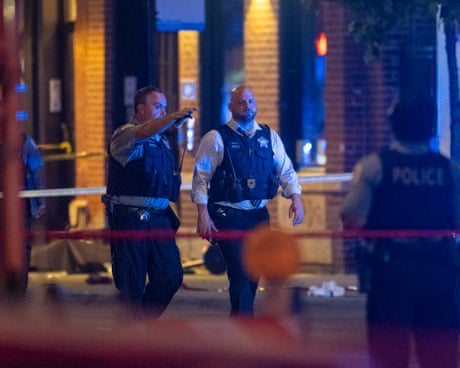 Police investigate the scene of a shooting