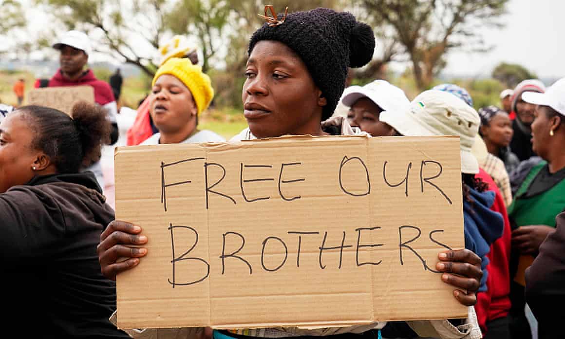 Relatives and friends protest near the gold mine where workers are trapped in Stilfontein, South Africa.