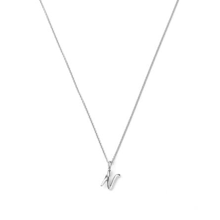 An ‘N’ Missoma Curly Molten Mini Initial Necklace in silver.