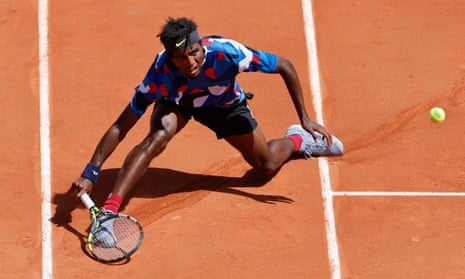 Elias Ymer plays a shot against Casper Ruud during their first round match of the 2023 French Open.