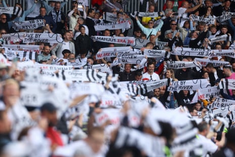 Fulham fans display flags inside the stadium before the match against Crystal Palace.