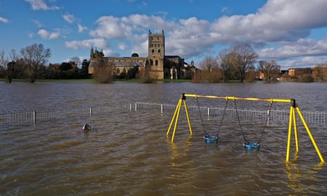Tewkesbury Abbey and a children’s playground at the confluence of the Rivers Severn and Avon on Friday.