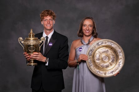 Jannik Sinner and Iga Swiatek with their Wimbledon trophies