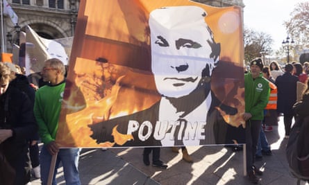 A banner featuring Vladimir ‘Poutine’ at a climate protest in Paris in November 