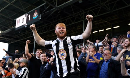Newcastle United fans celebrate. 