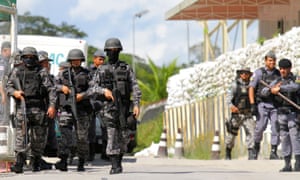 Policemen are seen during a riot in a prison in Brazil