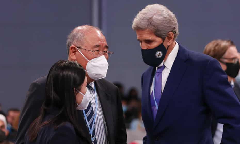 John Kerry speaking with China’s envoy Xie Zhenhua.