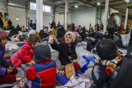 Migrants in makeshift accommodation near the Polish border.