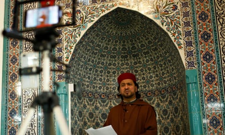 Imam Ajmal Masroor taking an online Friday prayer service during the Covid pandemic.