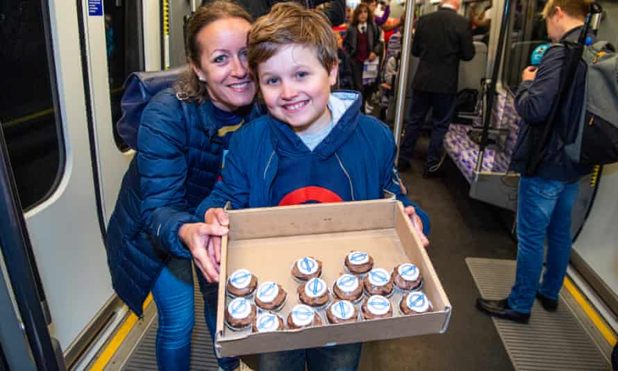 Agnes (Mom) and Sawyer Sarkadi-Smith and his cake for the train route.