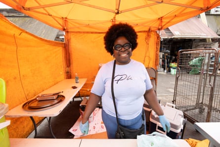 Benedicta Amadarkoa at her market stall which is covered by orange fabric