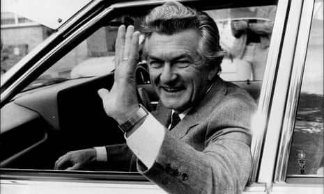 A black and white photo of Bob Hawke waving from a car window in 1983
