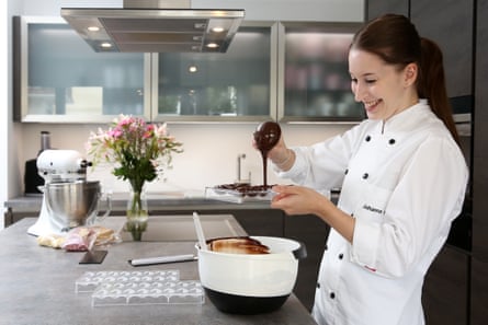 Johanna Orth drizzling chocolate into a mould