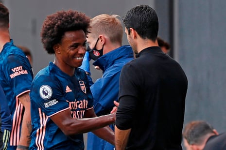 Arsenal’s Willian (left) looks pleased with his performance on his Premier League debut for the Gunners as he shakes hands with manager Mikel Arteta.